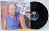 Front cover and vinyl record of Merle Haggard's Kern River LP with featured song sticker