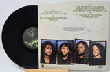 Metallica Justive for All cover featuring a the band members and track listing