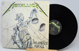 Metallica Justive for All cover featuring a statue with green writing