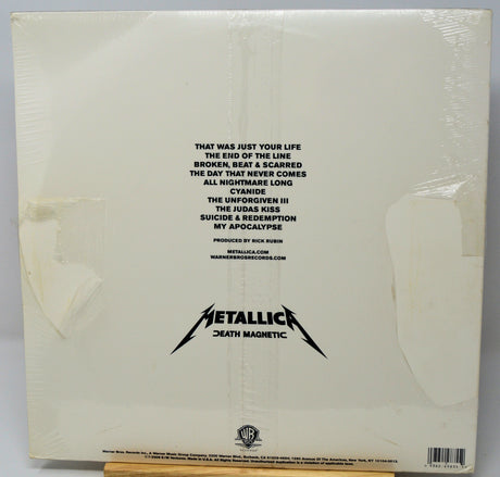 Back cover of a Metallica album with text and logo
