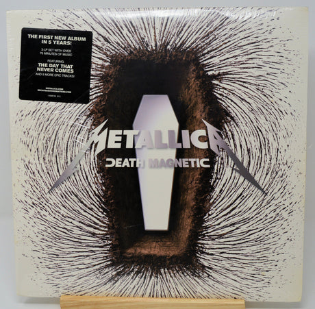 Metallica 'Death Magnetic' album cover with a coffin design on a white background