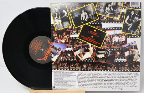 Vinyl record with a collage of photos on its cover