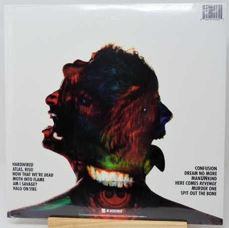 The back cover of a vinyl record for the band Klaceness, featuring a stylized, colorful portrait of a screaming face on a white background with tracklist text on the left and right sides.