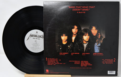 Vinyl record with its cover featuring a band on a white background