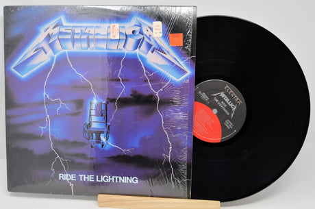 Vinyl record with 'Ride the Lightning' album cover featuring a futuristic design.