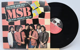 Front cover of Michael Stanley Band's Fourth and Ten vinyl LP featuring the band and checkered design