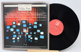 Front cover and record of Mike Post's Television Theme Songs vinyl LP with TV screens and conductor