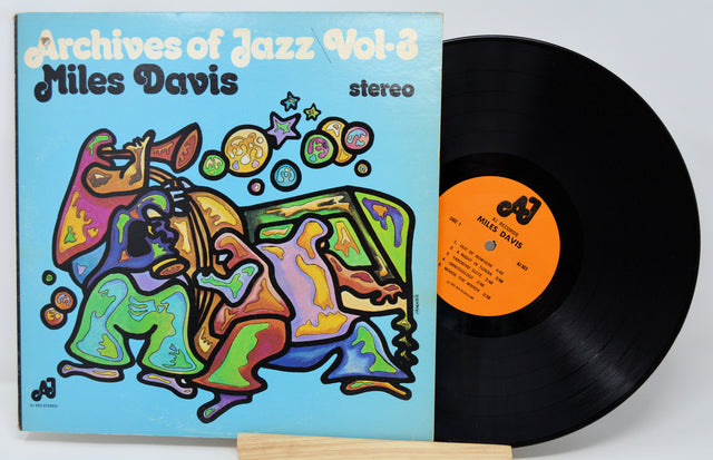 Vinyl record with colorful cover featuring Miles Davis' 'Archives of Jazz Vol. 2'.