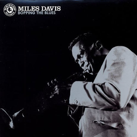 Album cover featuring Miles Davis playing the trumpet with text 'Miles Davis Bopping the Blues' on a black background.