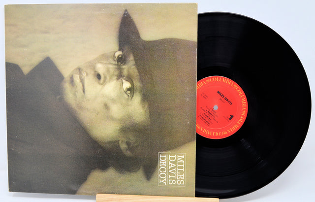 Vinyl record with cover featuring a portrait and 'Miles Davis Decoy' text.