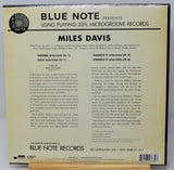 Back cover of a Blue Note Records vinyl record sleeve for Miles Davis, showing track listing and descriptive text on a beige background with the Blue Note logo at the top.