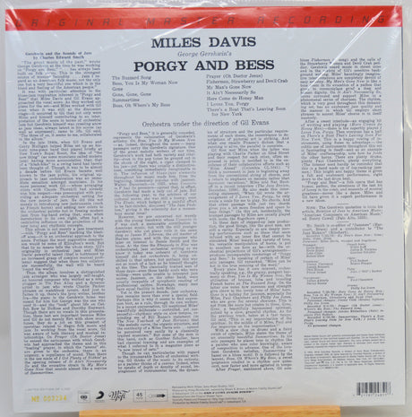 The back cover of a vinyl record sleeve for Miles Davis's 'Porgy and Bess' on Columbia Records, wrapped in protective plastic. The cover features a white background with black text, a red top banner.