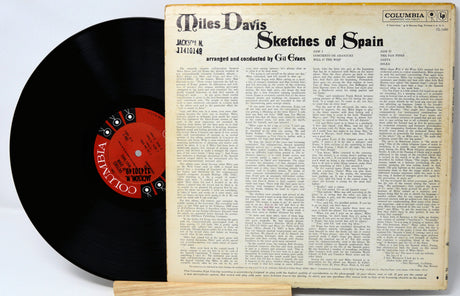 Vinyl record with cover displaying 'Miles Davis Sketches of Spain' on a white background