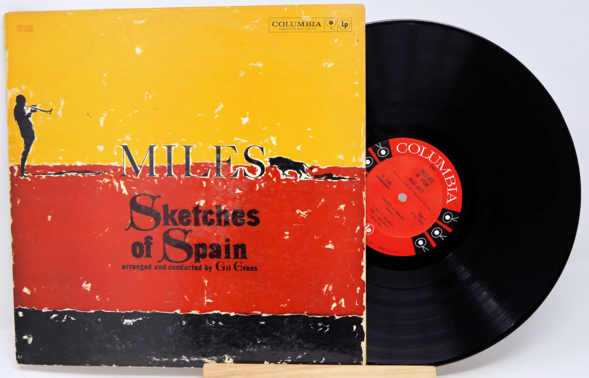 Vinyl record and cover of 'Sketches of Spain' by Miles Davis on a white background