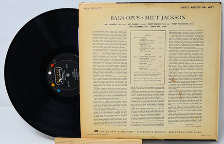 Vinyl record with text on the cover against a light background
