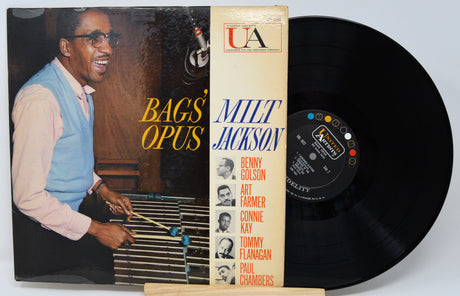 Vinyl record with cover featuring a musician and text 'Bags' Opus Milt Jackson' on a white background.