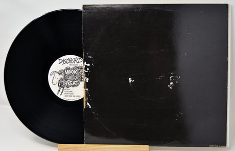 Vinyl record with a visible label on a white background