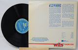 Vinyl record with a white sleeve featuring text and logos on a light gray background