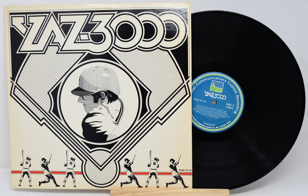 Vinyl record with cover featuring a stylized illustration of a person and baseball players, on a white background.