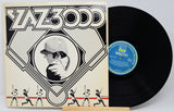 Vinyl record with cover featuring a stylized illustration of a person and baseball players, on a white background.