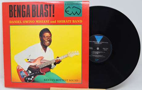 Vinyl record with a colorful cover featuring a man playing guitar, titled 'Benga Blast!'.