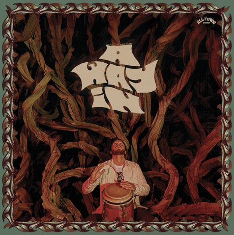 Man playing a drum with a ship in the sky, surrounded by intricate patterns.
