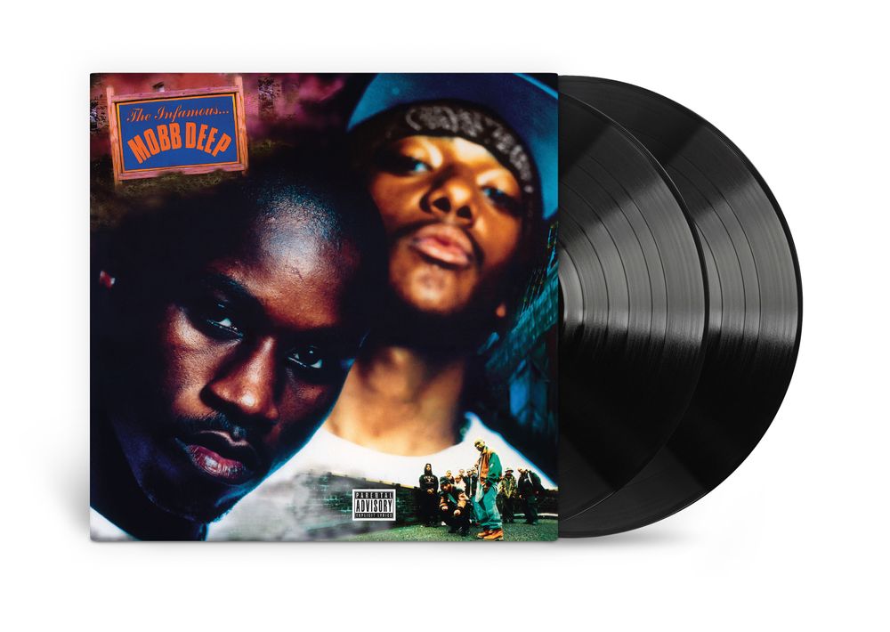 Vinyl record with a colorful cover featuring two faces and album art.