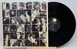 Vinyl record with cover featuring black and white images and text 'Models Out of Sight' on a light gray background.
