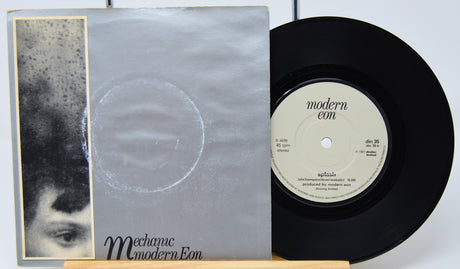 Vinyl record and cover with 'Modern Econ' label on a white background
