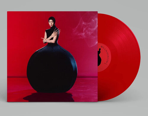 Red vinyl record with avant-garde album cover featuring a woman in a black dress against a red background