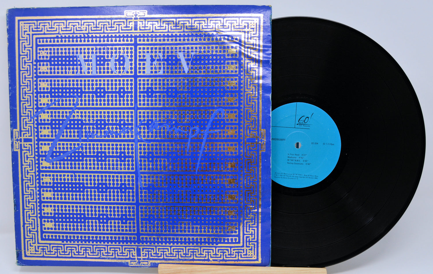 Vinyl record with blue label and cover on a white background