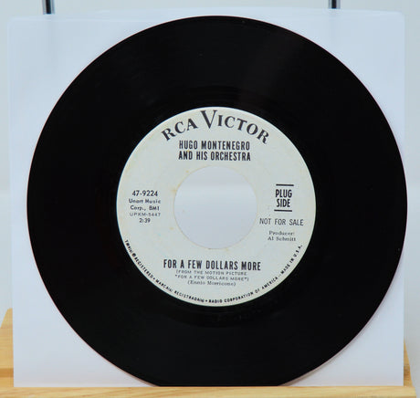 Black vinyl record with white label on a white background