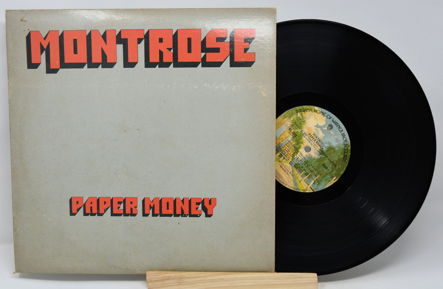 Vinyl record and cover with 'Montrose Paper Money' on a white background