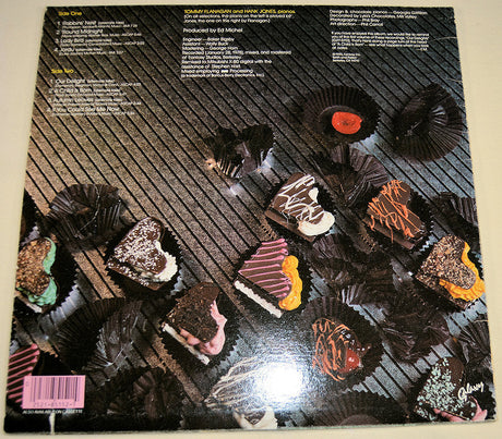 Back cover of More Delights album showing chocolates and song information