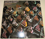 Front cover of More Delights album with heart-shaped chocolates and artist names