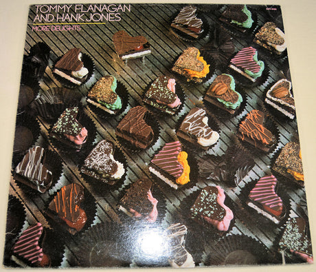 Front cover of More Delights album with heart-shaped chocolates and artist names