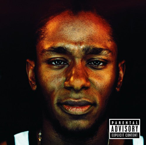 Mos Def's album 'Black On Both Sides' vinyl record cover featuring Mos Def's portrait with a 'Parental Advisory' label indicating explicit content.