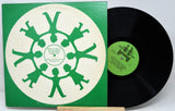 Front cover of Songs We'll Remember Forever vinyl album with green child silhouettes