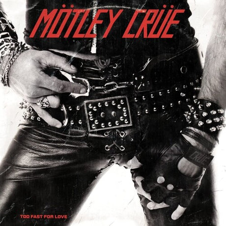 Motley Crüe album cover for 'Too Fast For Love' featuring a member of the band wearing a leather belt and gloves with a black and white photo style.