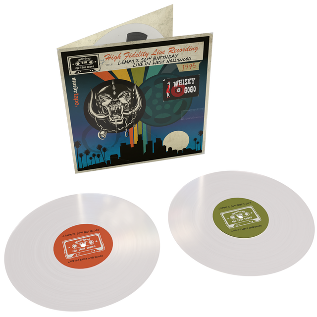 Vinyl records with colorful labels and a record cover featuring a skull and cityscape.