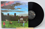 Vinyl record with cover featuring a group of people in a field and a horse.