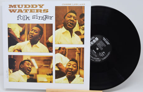 Muddy Waters 'folk singer' vinyl record LP shown with its album cover sleeve and the black record partially pulled out, photographed against a light gray background.