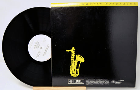 Vinyl record with a yellow saxophone illustration on a black background