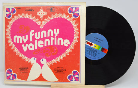 Front cover and vinyl record of My Funny Valentine album featuring a heart design with two doves