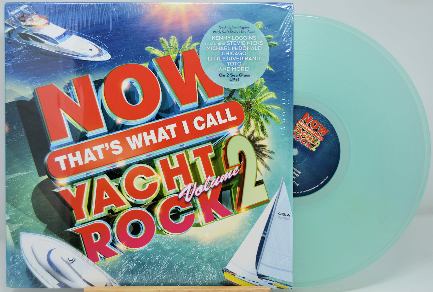 Vinyl record with colorful cover featuring 'Now That's What I Call Yacht Rock Volume 2' and a light blue disc.