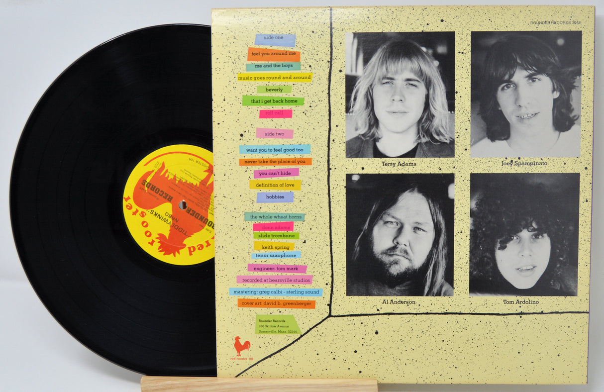 Vinyl record by NRBQ titled Tiddly Winks and the back cover showing pictures of the band members and song titles in text.