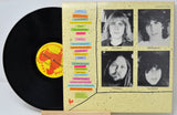 Vinyl record by NRBQ titled Tiddly Winks and the back cover showing pictures of the band members and song titles in text.
