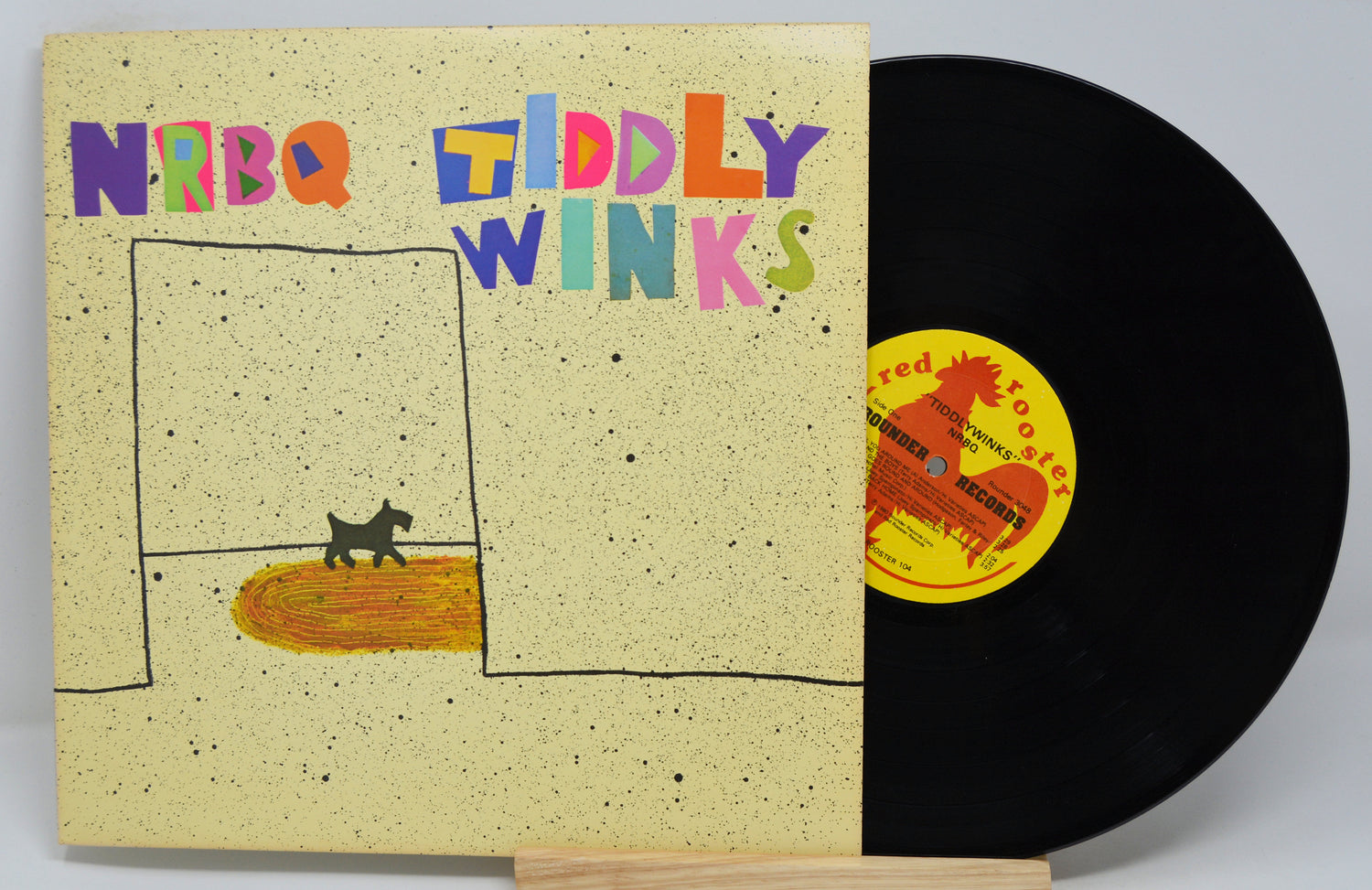 Vinyl record by NRBQ titled Tiddly Winks showing a drawing of a small dog in a room.