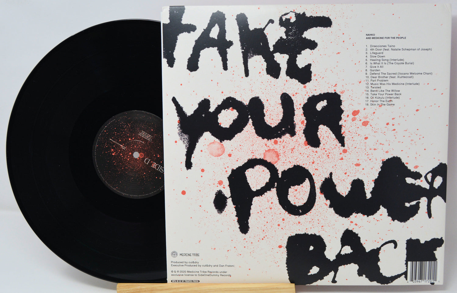 Vinyl record with a cover featuring the text 'Take Your Power Back' on a light gray background.