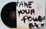 Vinyl record with a cover featuring the text 'Take Your Power Back' on a light gray background.